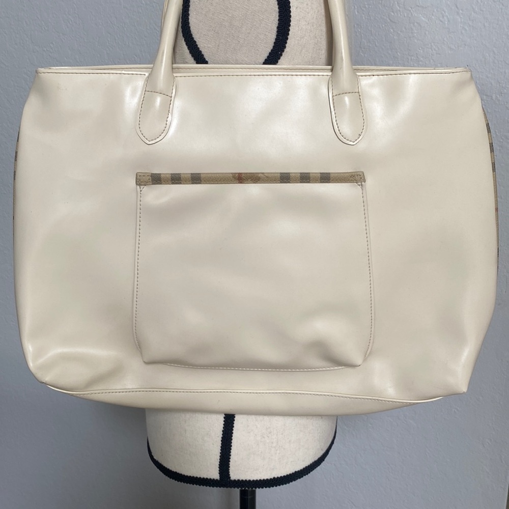 Burberry Large Cream Tote Bag with Hay market piping on sides.